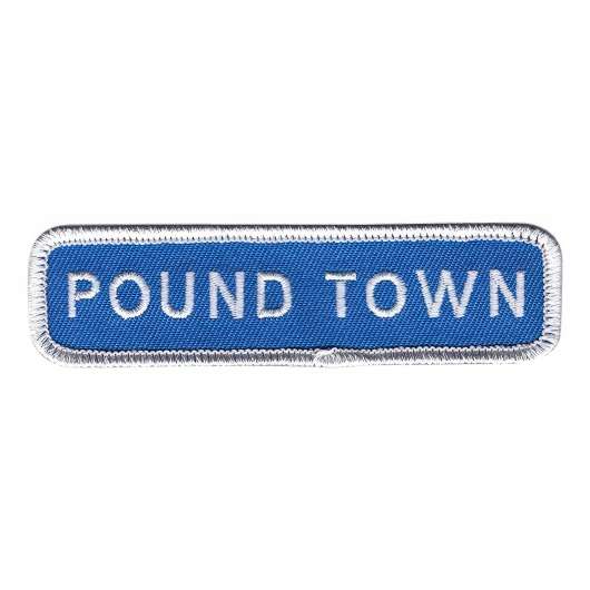Tygmärke Pound Town Vägskylt